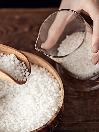 Homeopathy remedies in wooden bowl & glass jar